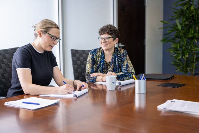 two lawyers in a conference room