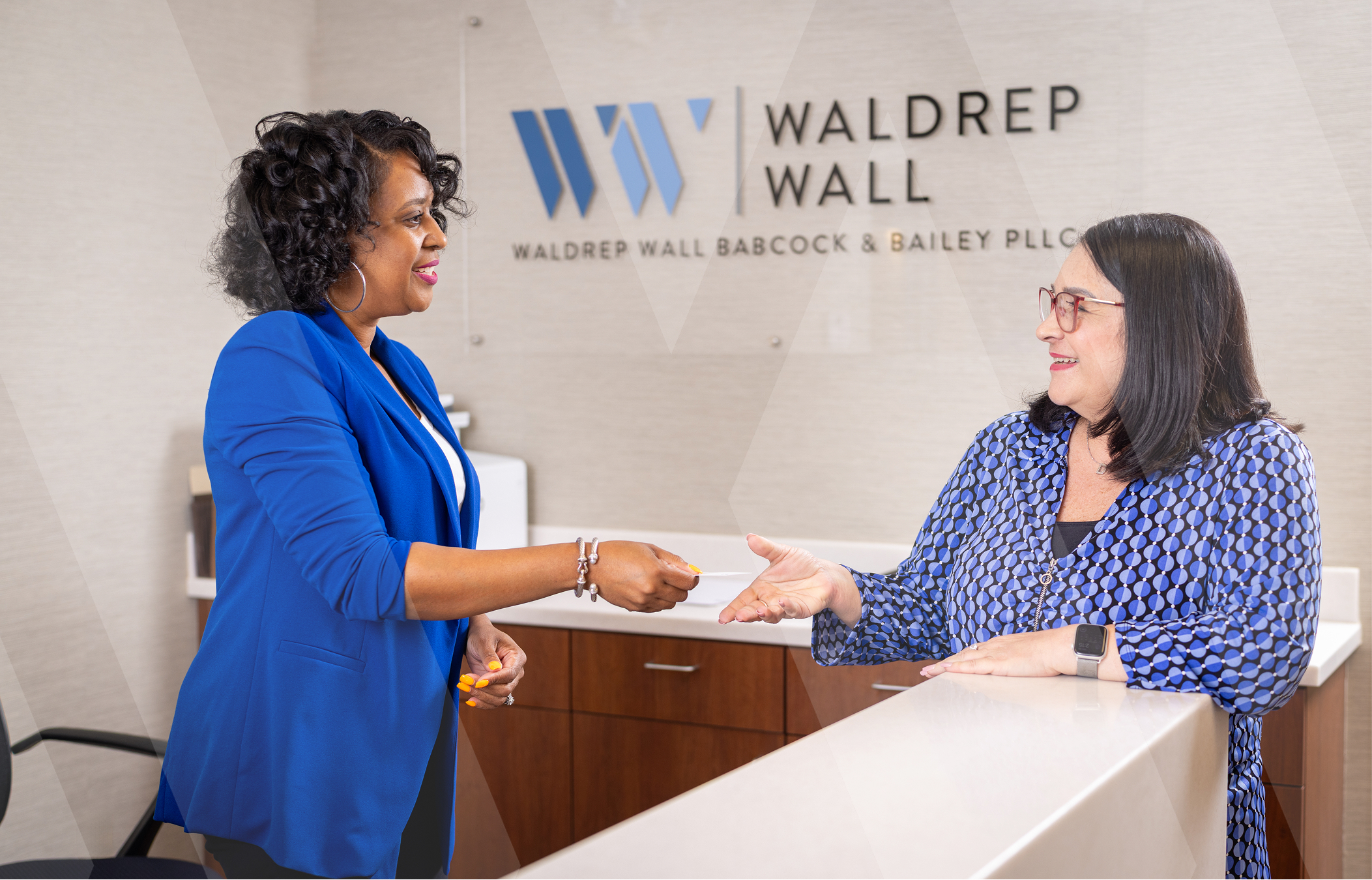 two law firm employees talking