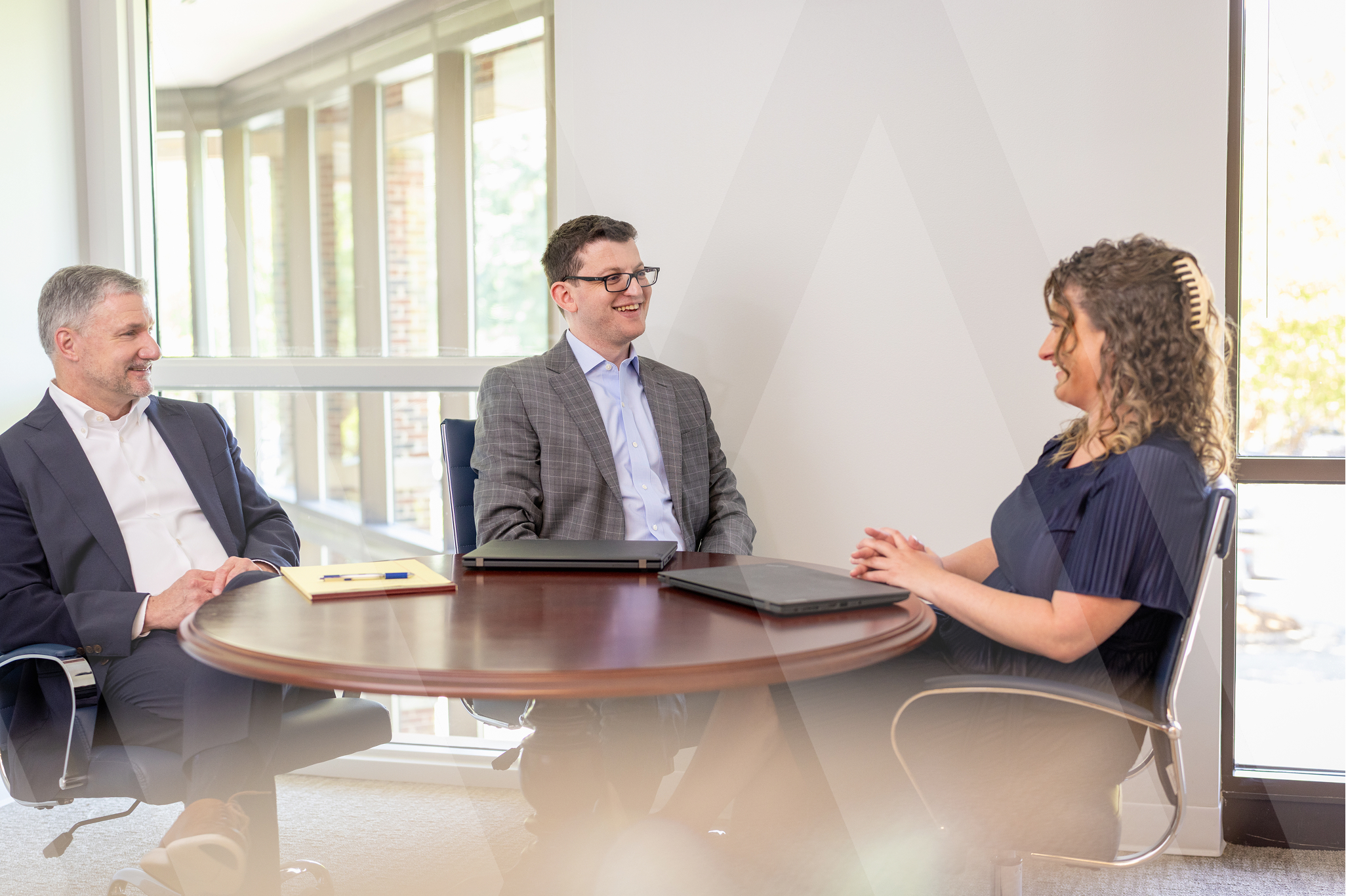 3 lawyers sitting at a table