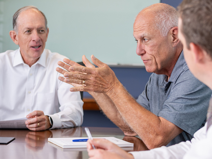 3 lawyers talking to each other